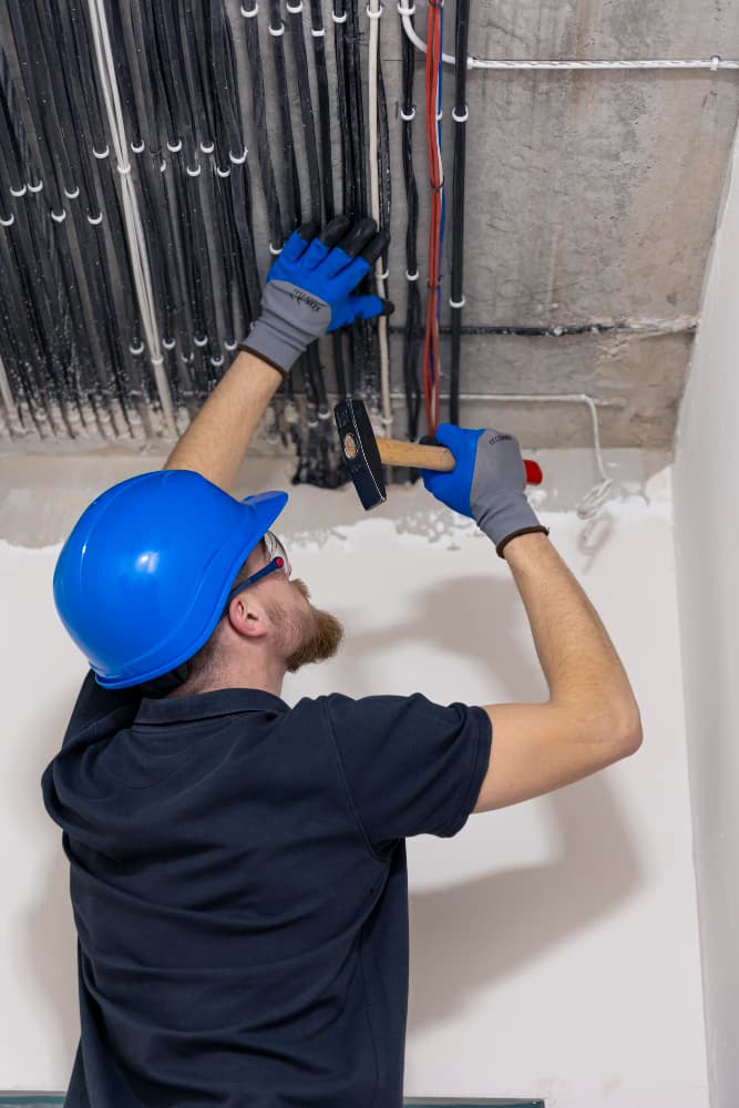Technician assessing electrical components